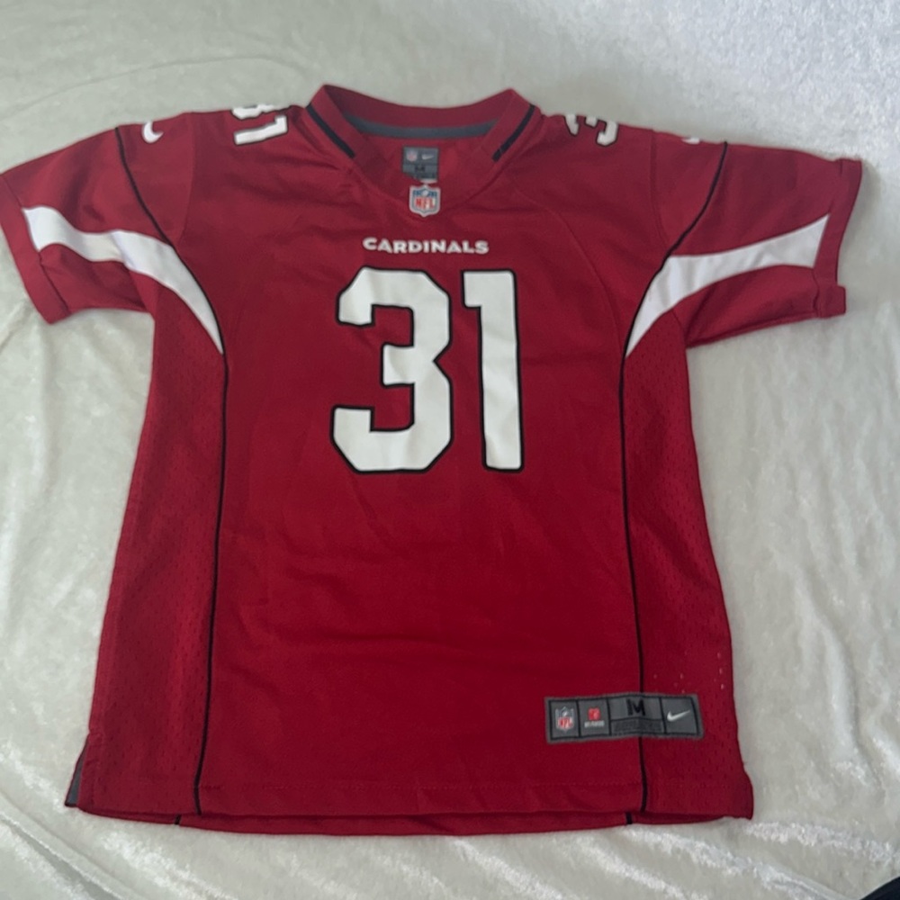 Brand new.  Authentic NFL Arizona Cardinals youth jersey (new without tags)